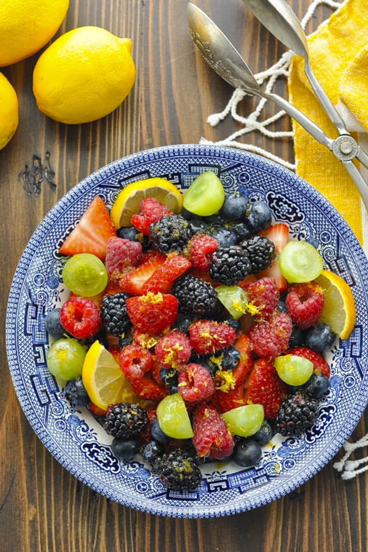 Overhead image of a bowl of fruit salad with honey lemon fruit salad dressing.