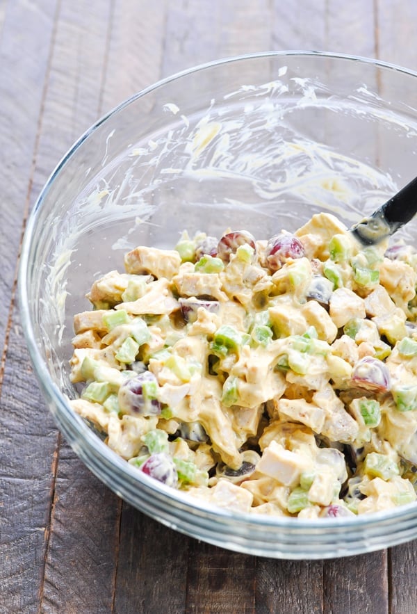 Curry chicken salad in a glass mixing bowl