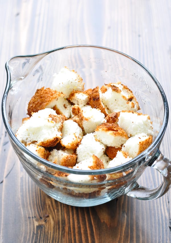 Angel food cake diced into squares in a glass bowl