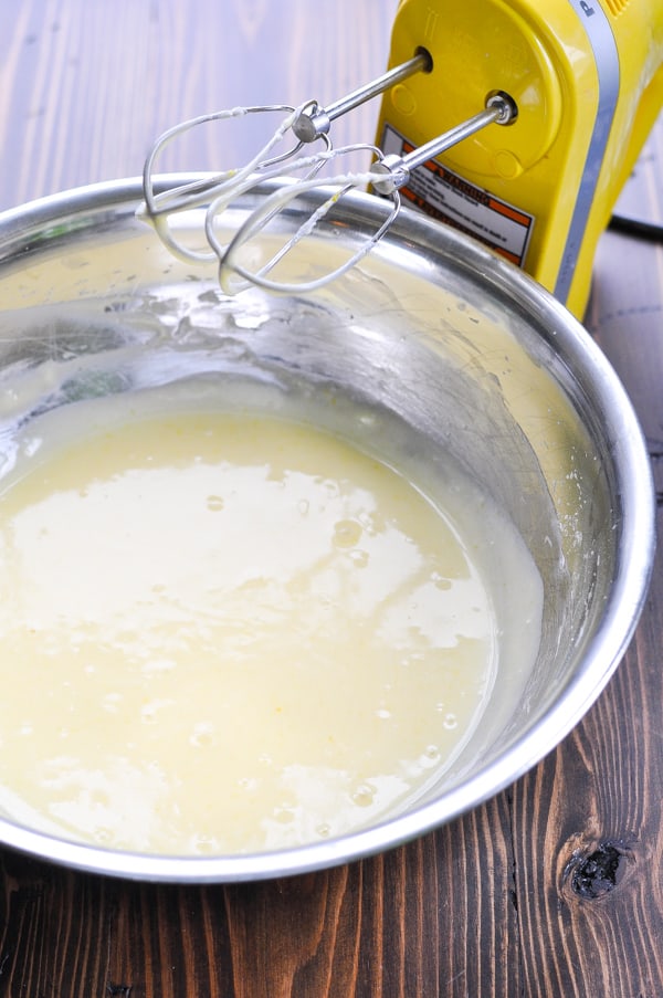 gooey butter cake top layer batter in a metal mixing bowl