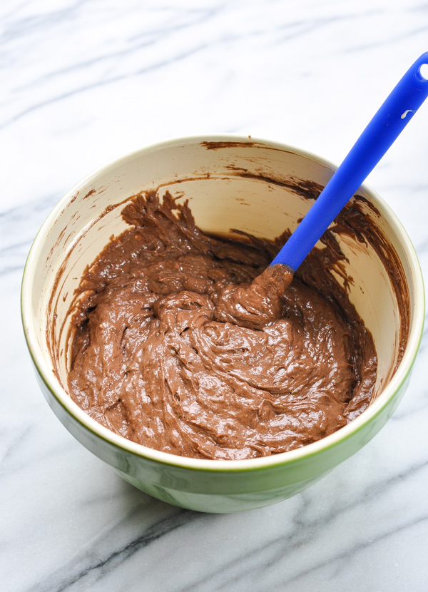 chocolate cake batter in a green bowl