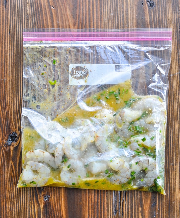 Shrimp marinating in a large plastic bag