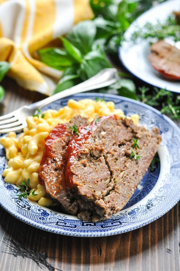 Two slices of slow cooker meatloaf on a plate