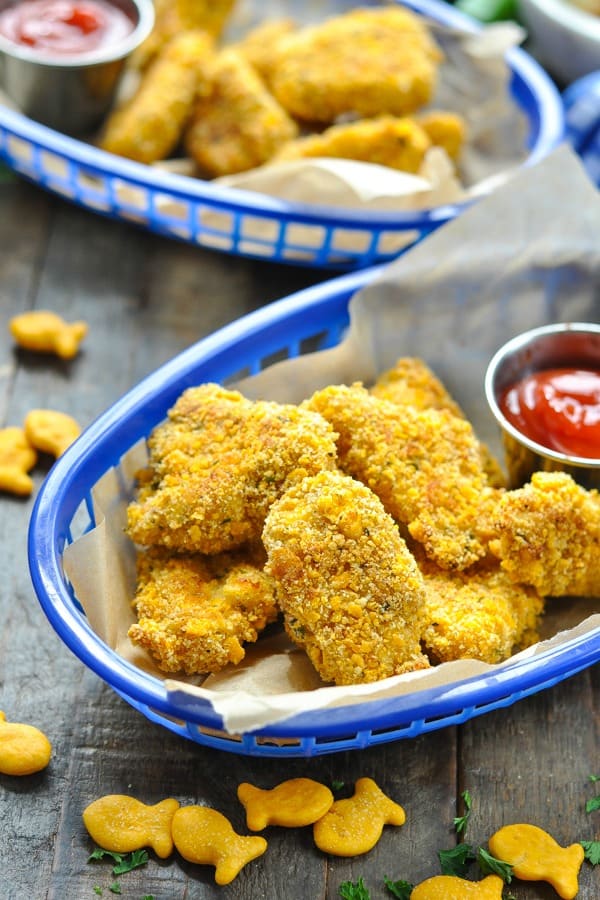 Close up front shot of homemade chicken nuggets recipe in a blue serving basket