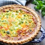 Baked broccoli quiche in blue pie plate