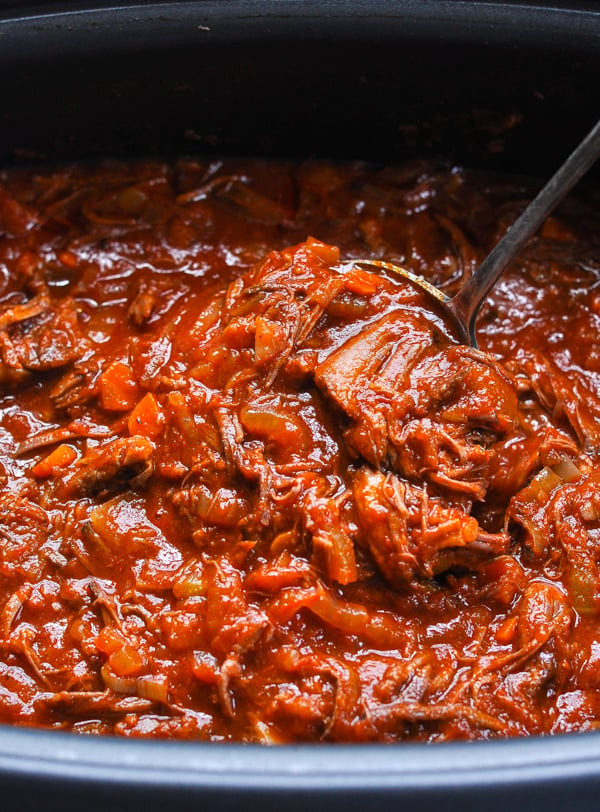 A close up shot of a completed beef ragu cooked in a slow cooker.