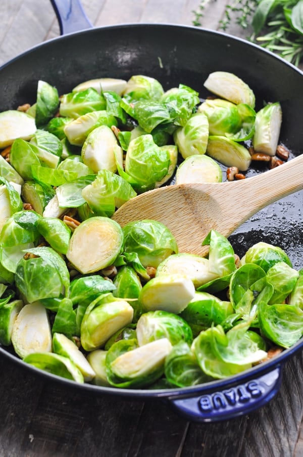 Raw brussels sprouts in a skillet