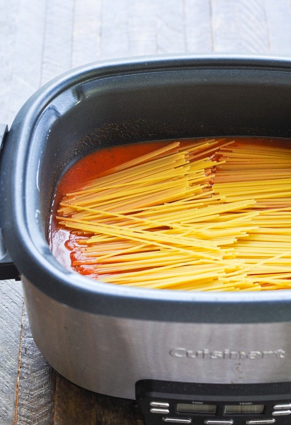 Uncooked spaghetti noodles in slow cooker