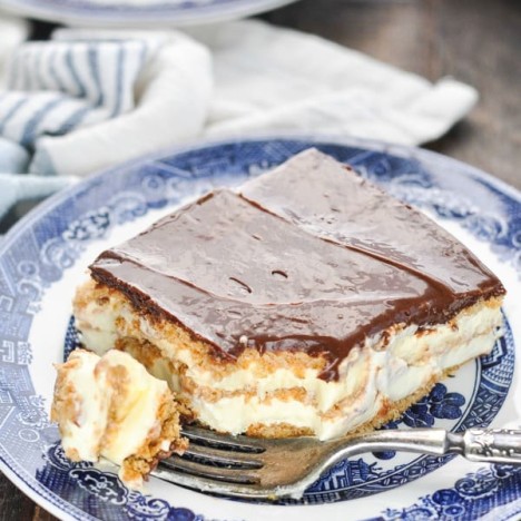 Long overhead shot of no bake eclair cake on a blue and white plate