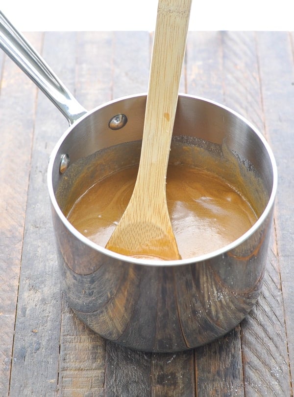 Peanut butter mixture for Cornflake cookies in a saucepan