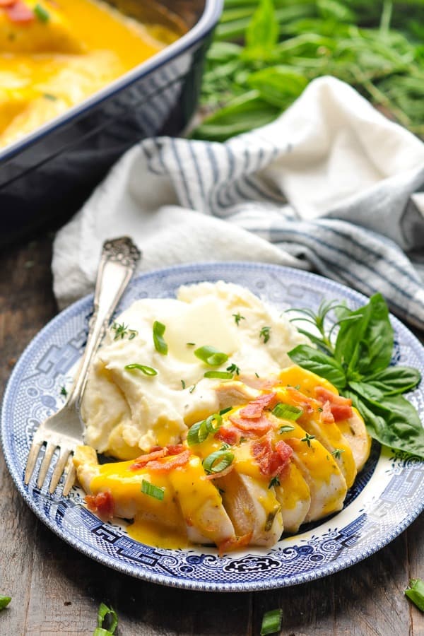 Crock Pot Ranch Chicken with Bacon and Cheese on a plate with mashed potatoes