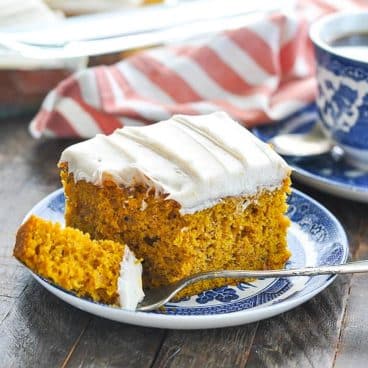 Square side shot of a slice of easy pumpkin cake with yellow cake mix.