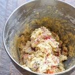 Fruitcake cookie dough in a large mixing bowl