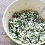 Filling mixture for spinach stuffed shells with ricotta cheese in a large mixing bowl