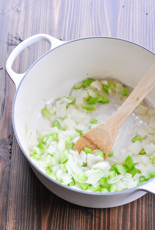 Celery and onion in a large Dutch oven