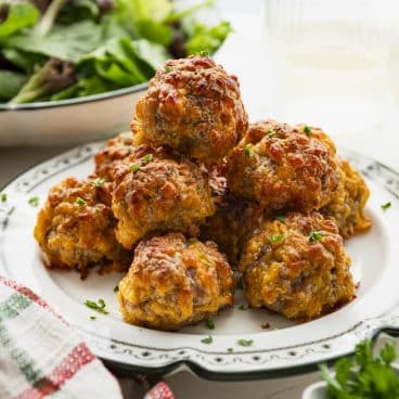 Square close up shot of a plate of Bisquick sausage balls.
