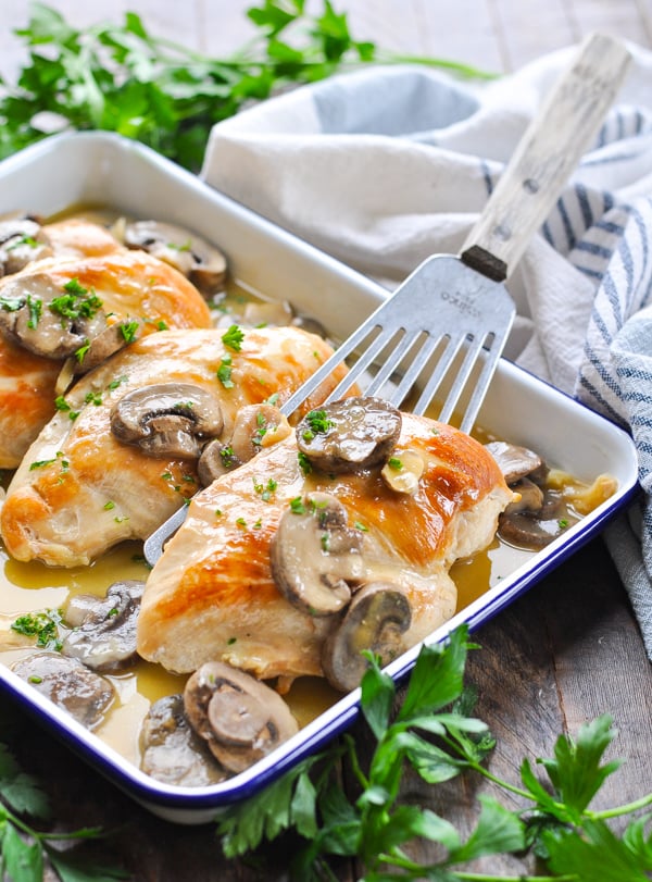 Diagonal front shot of tray of chicken and mushrooms recipe