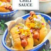 Chili dogs in a basket with text title overlay