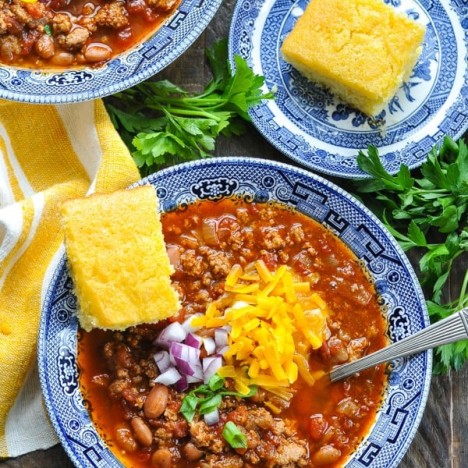 Overhead shot of a bowl of Instant Pot Turkey Chili with a side of cornbread