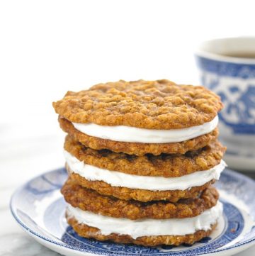 Close up front shot of three oatmeal cream pies stacked on a small plate