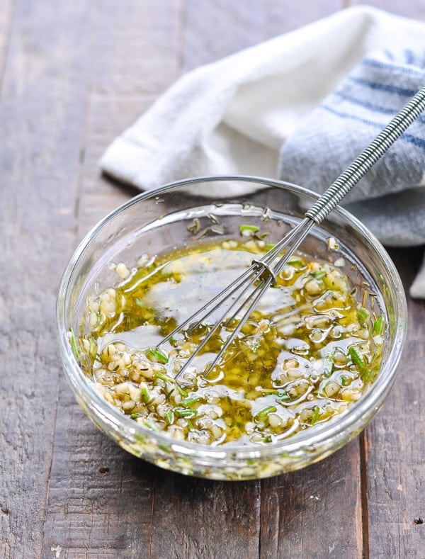 Olive oil with garlic and herbs in a small bowl