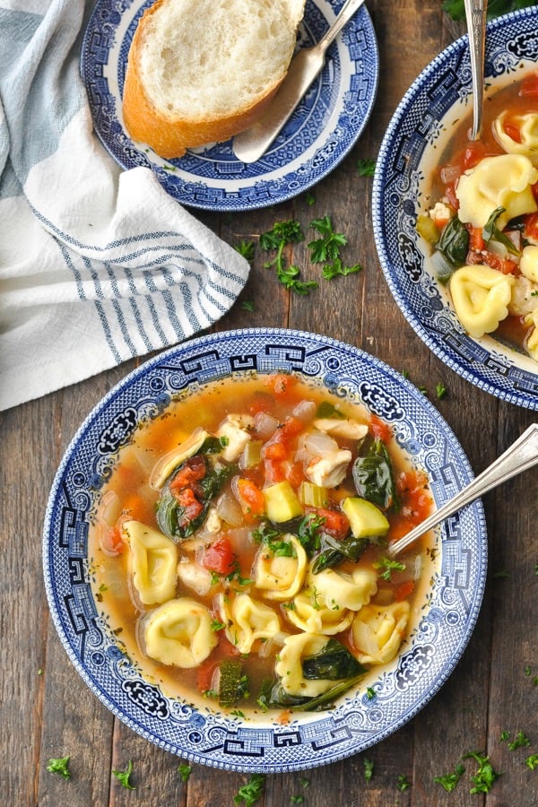 Close overhead shot of chicken tortellini soup with a spoon