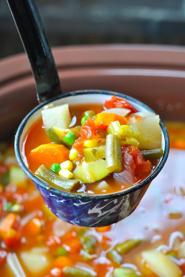Ladle full of Crock Pot Vegetable Soup