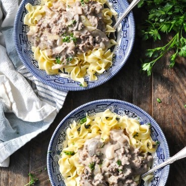 Overhead shot of two bowls of ground beef stroganoff with noodles