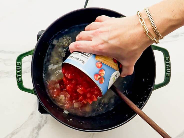 Adding canned diced tomatoes.