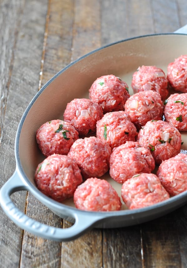 Porcupine meatballs in a baking dish before putting them in the oven