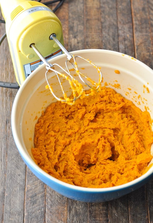 Mashed sweet potatoes for casserole in a mixing bowl