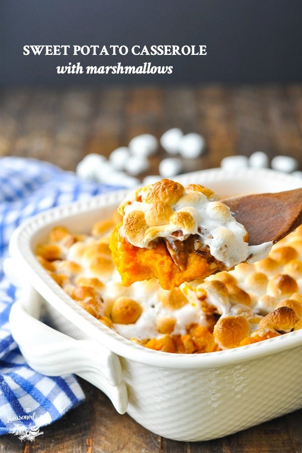 Sweet potato casserole with marshmallows in a white baking dish with text overlay