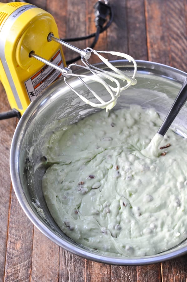 Batter for watergate cake in a mixing bowl