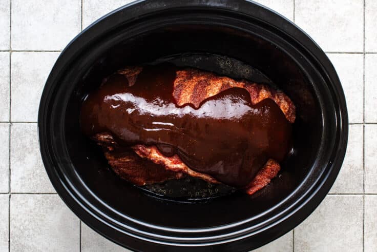 Ingredients for slow cooker baby back ribs in the crock pot before cooking.