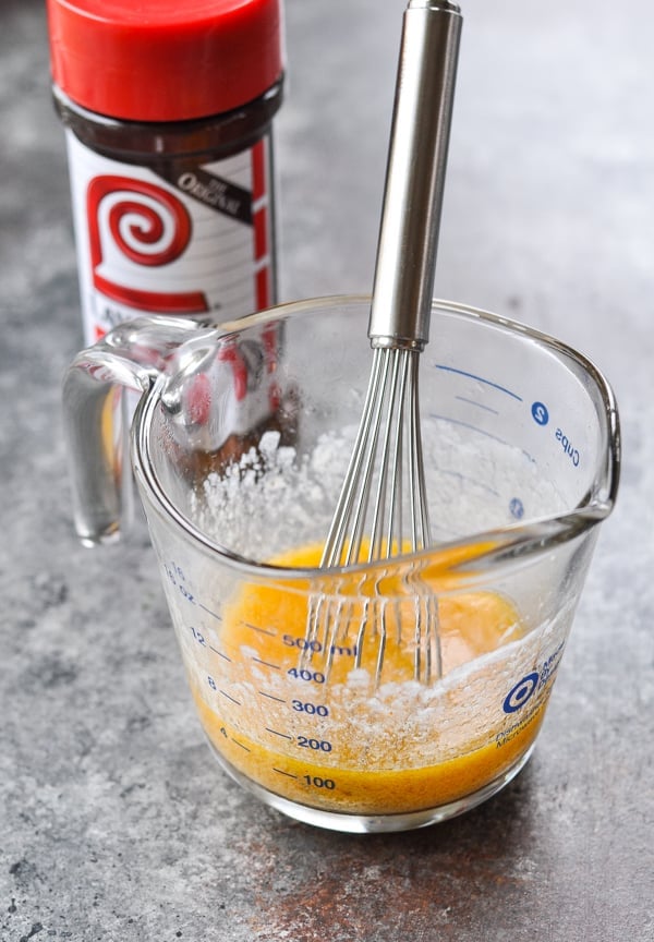 Melted butter whisked with seasoned salt in a measuring cup
