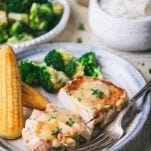 Broccoli and cornbread on a plate with the best crock pot ranch pork chop recipe