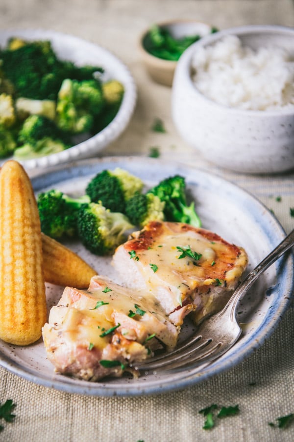 Broccoli and cornbread on a plate with the best crockpot ranch pork chop recipe