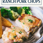 Close up side shot of a plate of sliced ranch pork chops with text title box at top.