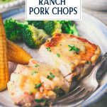 Close up side shot of sliced ranch pork chops on a plate with text title overlay.