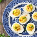 Close overhead shot of easy deviled eggs on a blue and white plate