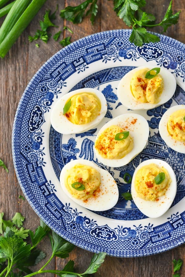 Close overhead shot of easy deviled eggs on a blue and white plate
