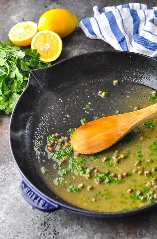 Traditional piccata sauce in a cast iron skillet