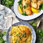 Chicken piccata on a serving tray with an individual bowl nearby