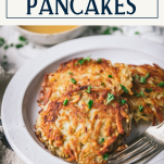 Side shot of plate of potato pancakes with text title box at top