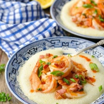 Front shot of a southern shrimp and grits recipe in a blue and white bowl