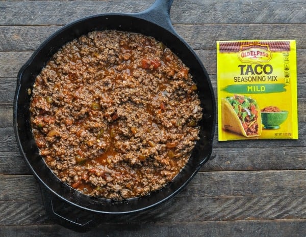 Cooked taco meat in a cast iron skillet