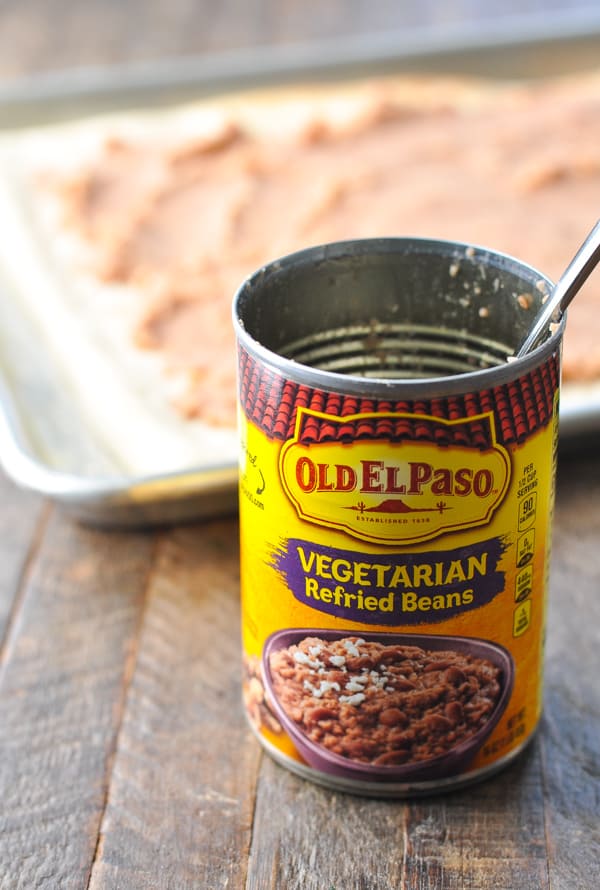 Can of refried beans to spread on Mexican pizza