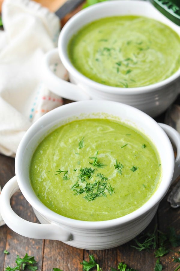 Close up front shot of a bowl of creamy asparagus soup