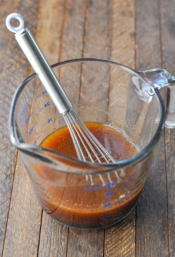 Marinade for steak tips in a glass measuring cup