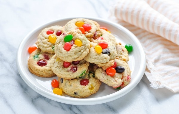 Horizontal shot of a white plate full of jelly bean cookies